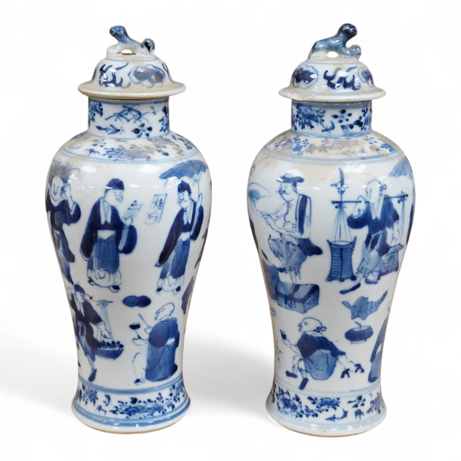 A pair of 19th century Chinese blue and white vases and covers. 22.5cm high